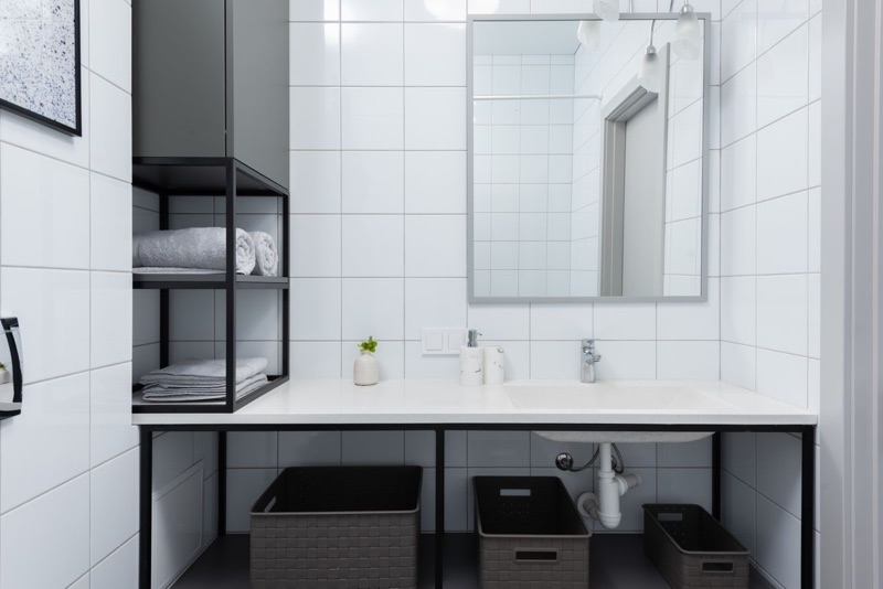 A spotless bathroom sink and tiling